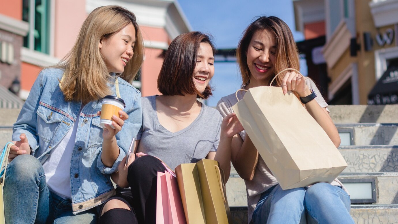 happy shoppers with shopping bags