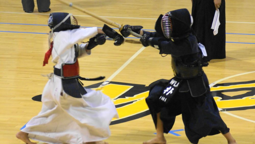 kendo practitioners sparring with shinai