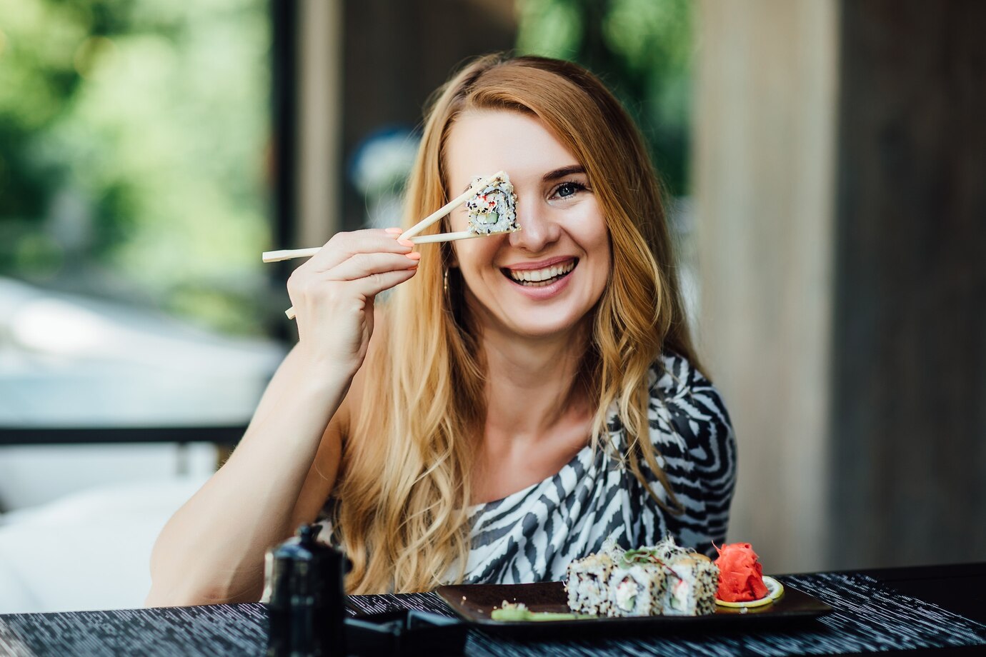 someone calmly enjoying sushi