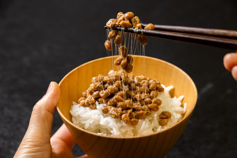 natto being stirred with chopsticks