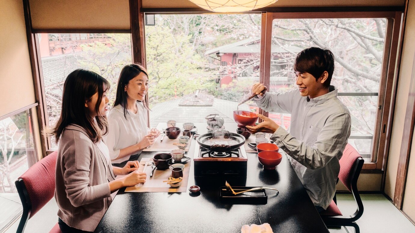 people enjoying hotpot during winter season