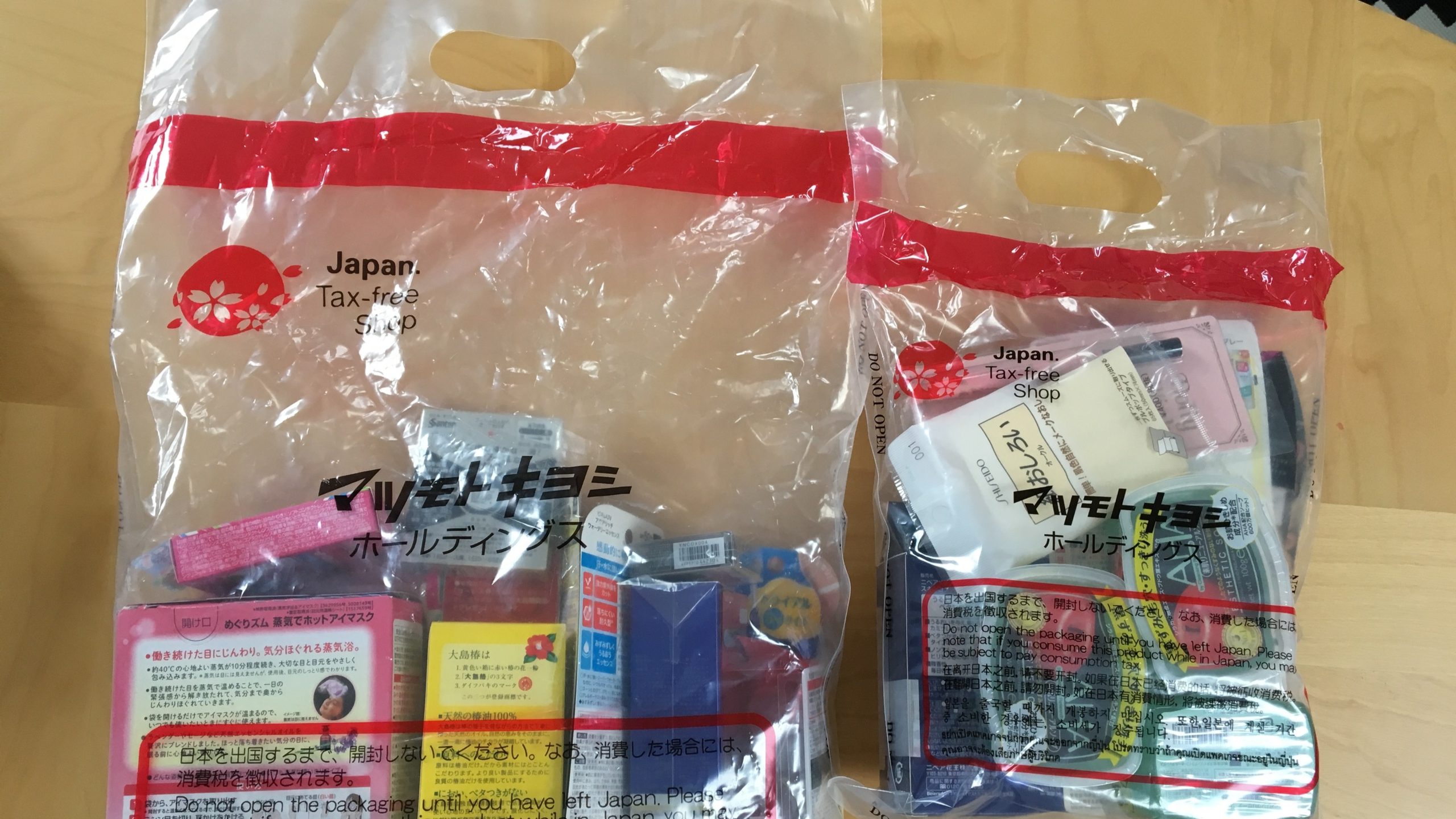 tax-free sign and shopping bag with Japanese items