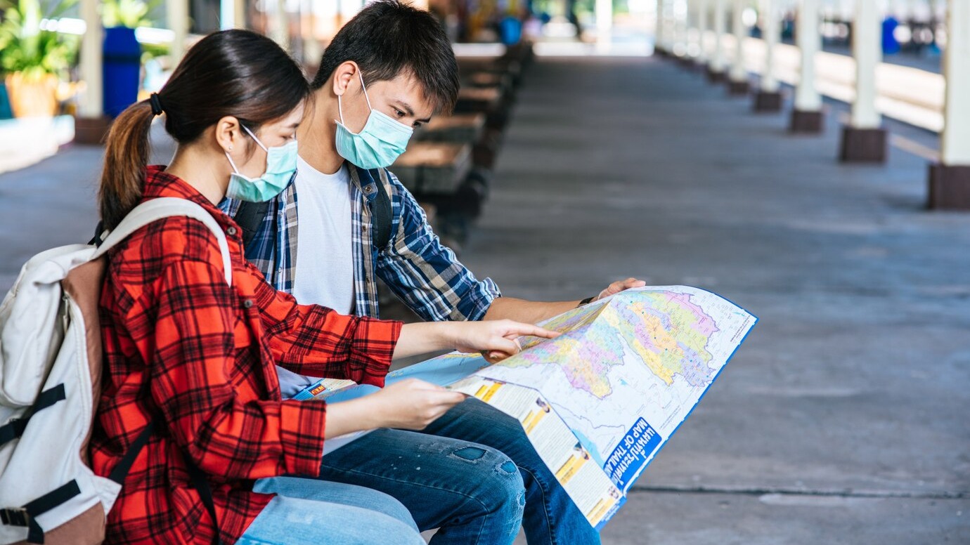 traveler planning with train schedule map